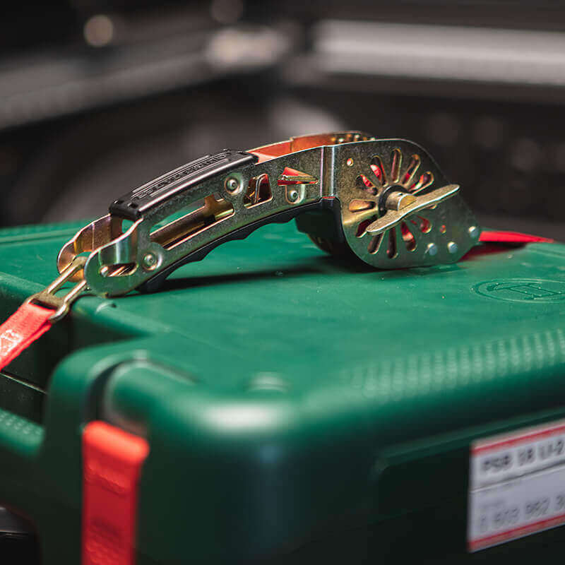 QUICKLOADER Grip Carrying Handle on top of a green tool box